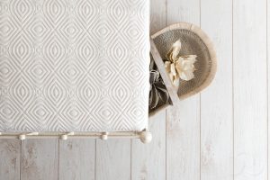 Lifestyle photograph of a mattress with a basket