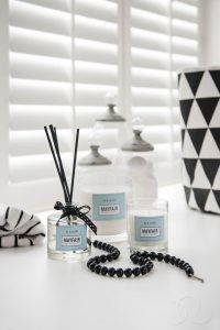 Lifestyle Photograph of candles and oil diffusers